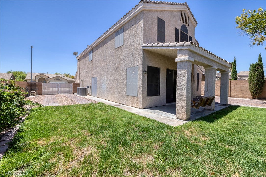 The side yard provides rare at-home RV Parking behind your own gates.