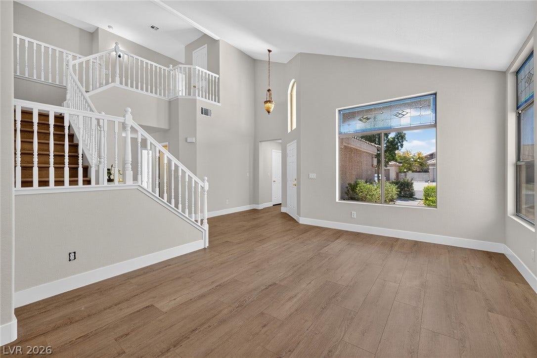 A grand entrance welcomes you with soaring ceilings, creating an airy and inviting atmosphere.