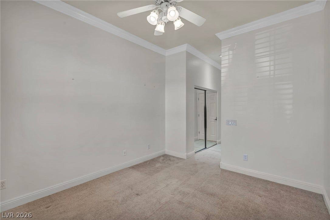 37 Stonemark Drive, Henderson, NV 89052 Unfurnished room featuring crown molding, light colored carpet, baseboards, and a ceiling fan