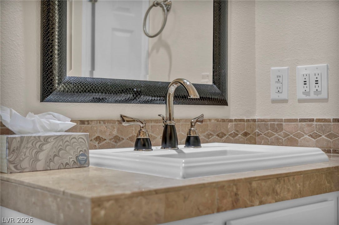 37 Stonemark Drive, Henderson, NV 89052 Details with a sink and a textured wall