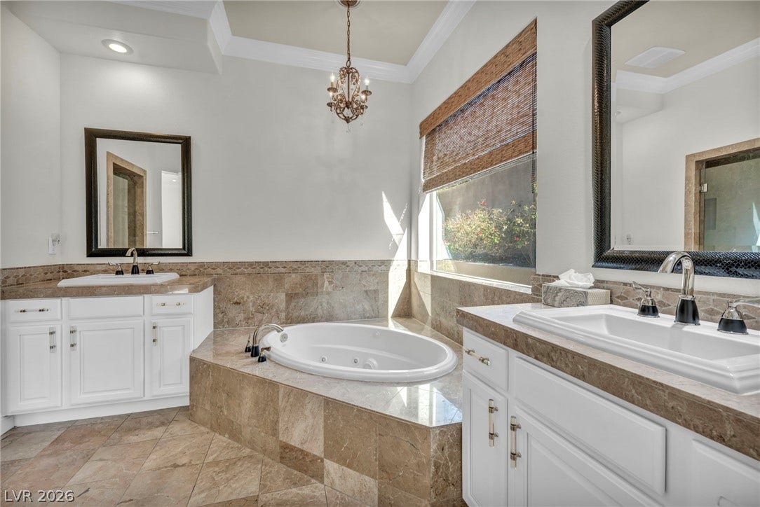 37 Stonemark Drive, Henderson, NV 89052 Full bathroom with two vanities, a sink, crown molding, and a tub with jets
