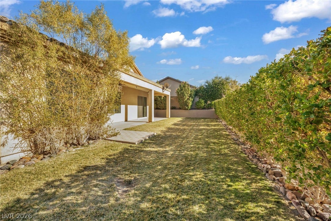 37 Stonemark Drive, Henderson, NV 89052 View of yard featuring a patio and fence