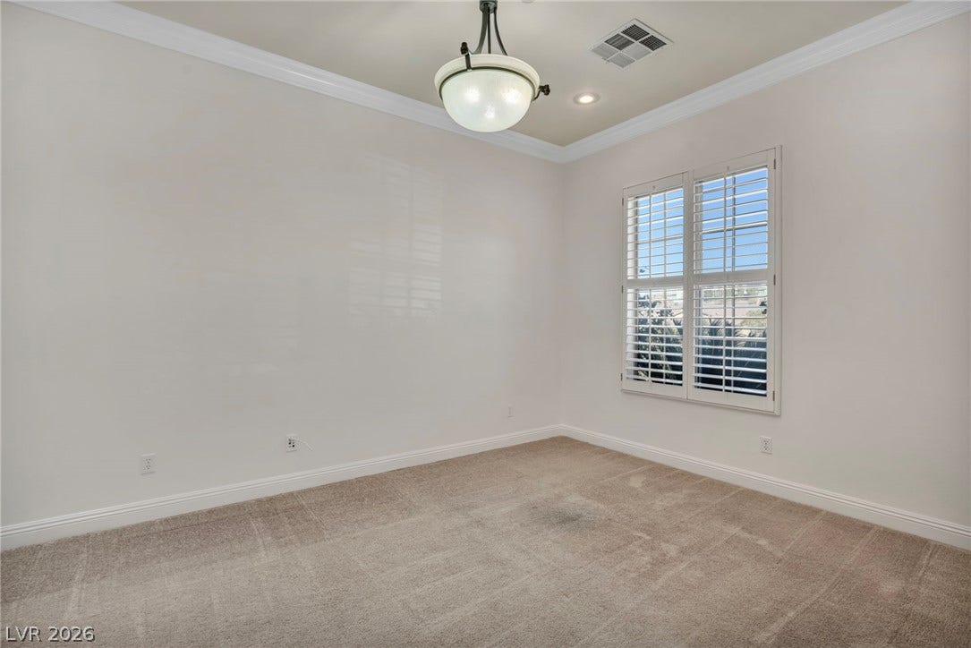 37 Stonemark Drive, Henderson, NV 89052 Unfurnished room with visible vents, baseboards, ornamental molding, recessed lighting, and light colored carpet