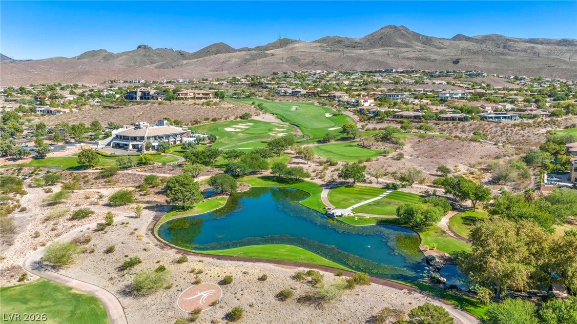 37 Stonemark Drive, Henderson, NV 89052 Drone / aerial view with a residential view, golf course view, and a water and mountain view