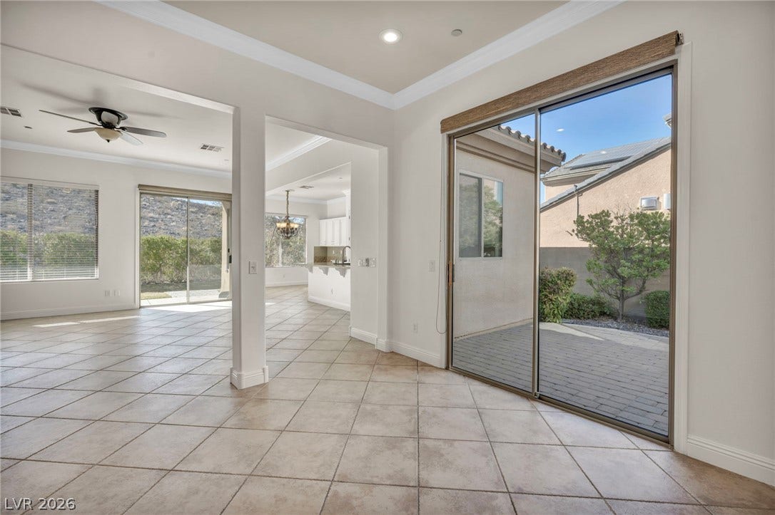 37 Stonemark Drive, Henderson, NV 89052 Entryway featuring crown molding, baseboards, a ceiling fan, and light tile patterned flooring