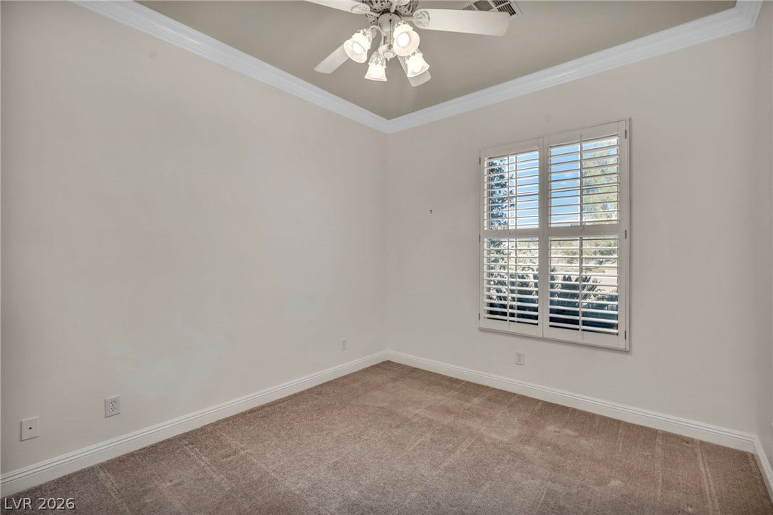 37 Stonemark Drive, Henderson, NV 89052 Carpeted empty room featuring baseboards, a ceiling fan, and ornamental molding