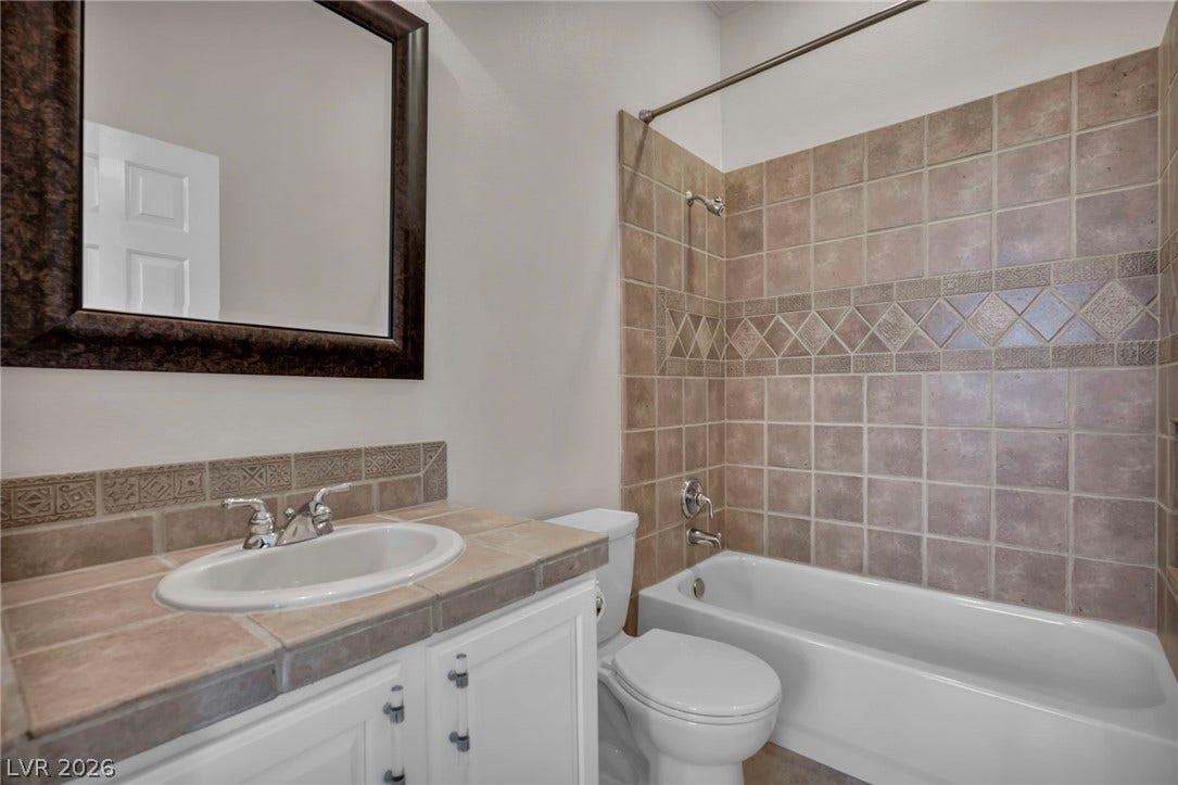 37 Stonemark Drive, Henderson, NV 89052 Full bathroom with toilet, vanity, and shower combination
