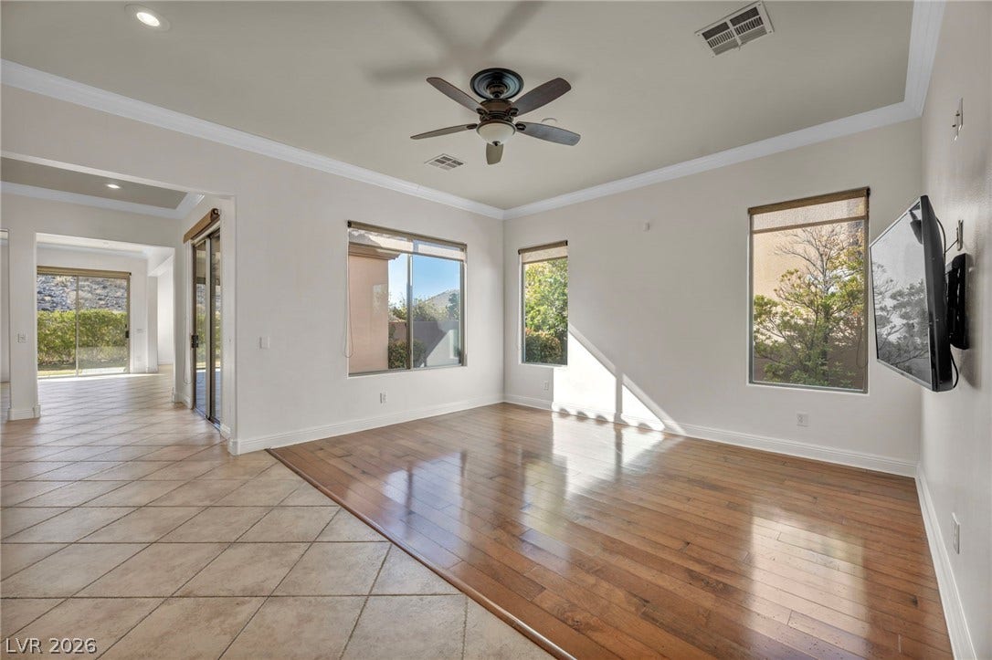 37 Stonemark Drive, Henderson, NV 89052 Unfurnished room featuring light wood-style flooring, visible vents, ceiling fan, and baseboards