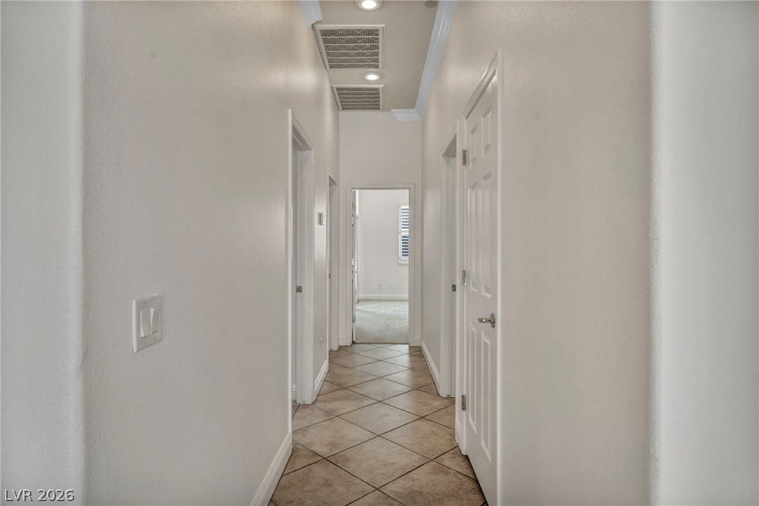 37 Stonemark Drive, Henderson, NV 89052 Hallway featuring light tile patterned floors, baseboards, and visible vents