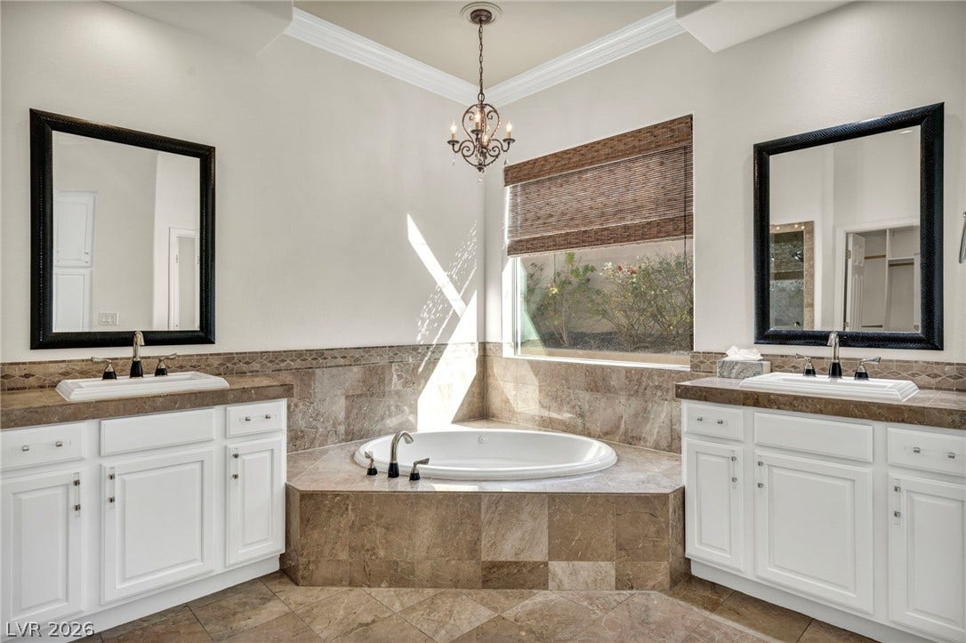 37 Stonemark Drive, Henderson, NV 89052 Full bathroom with a sink, ornamental molding, two vanities, and an inviting chandelier