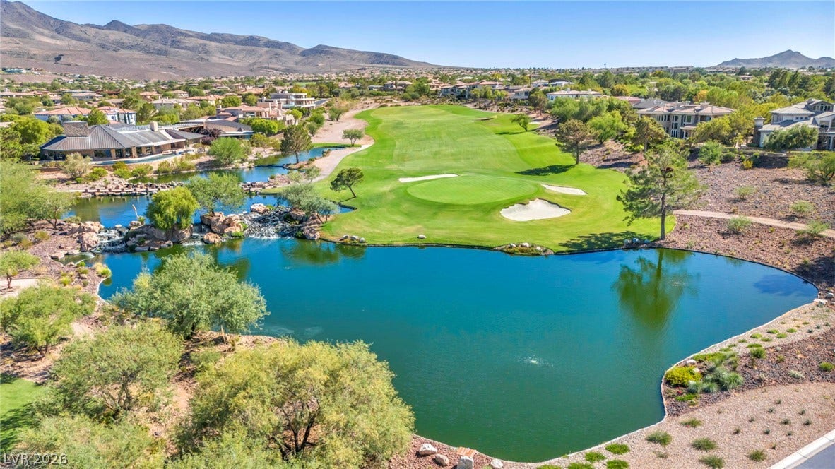 37 Stonemark Drive, Henderson, NV 89052 Aerial view with view of golf course, a residential view, and a water and mountain view