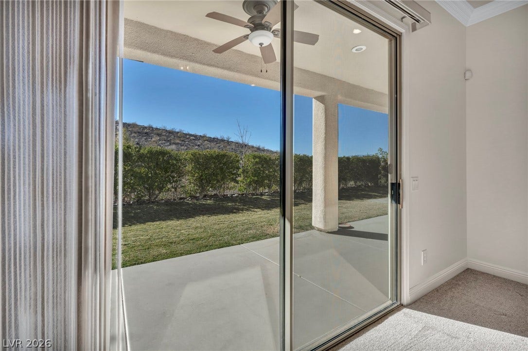 37 Stonemark Drive, Henderson, NV 89052 Doorway featuring crown molding, ceiling fan, recessed lighting, carpet floors, and baseboards