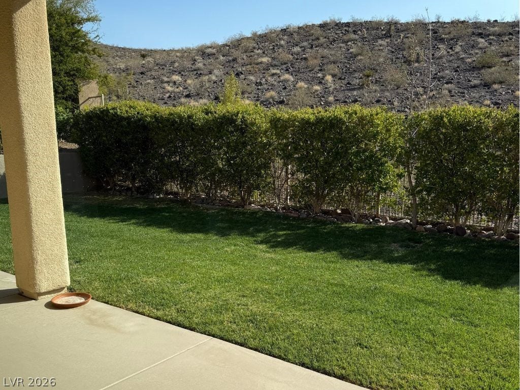 37 Stonemark Drive, Henderson, NV 89052 View of rear yard/mountain featuring fence