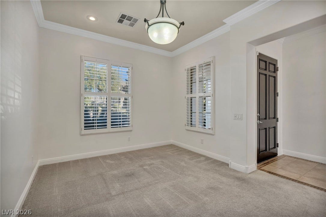 37 Stonemark Drive, Henderson, NV 89052 Empty room with ornamental molding, visible vents, and light colored carpet