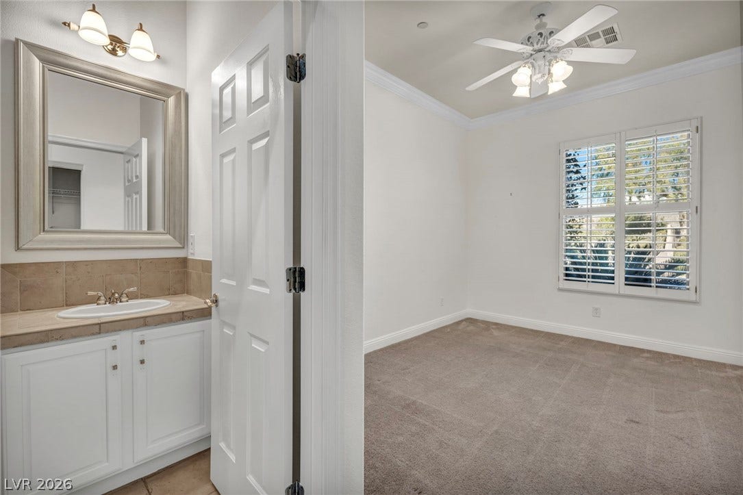 37 Stonemark Drive, Henderson, NV 89052 Bathroom featuring visible vents, baseboards, ornamental molding, a ceiling fan, and vanity