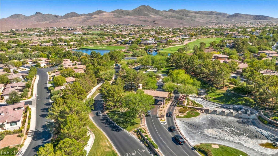 37 Stonemark Drive, Henderson, NV 89052 Bird's eye view featuring golf course view, a water and mountain view, and a residential view