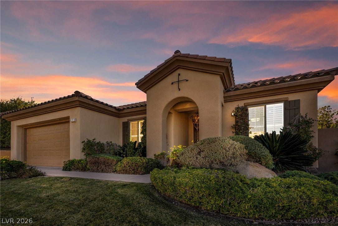 37 Stonemark Drive, Henderson, NV 89052 Mediterranean / spanish-style house featuring a tiled roof, a garage, stucco siding, and a front yard