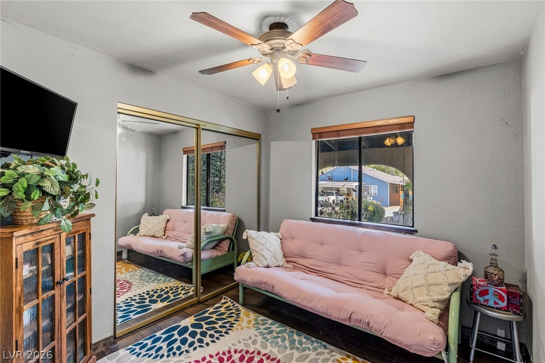 29 Cottonwood Drive, Blue Diamond, NV 89004 Mirrored closet doors and wood flooring define this versatile room setup.