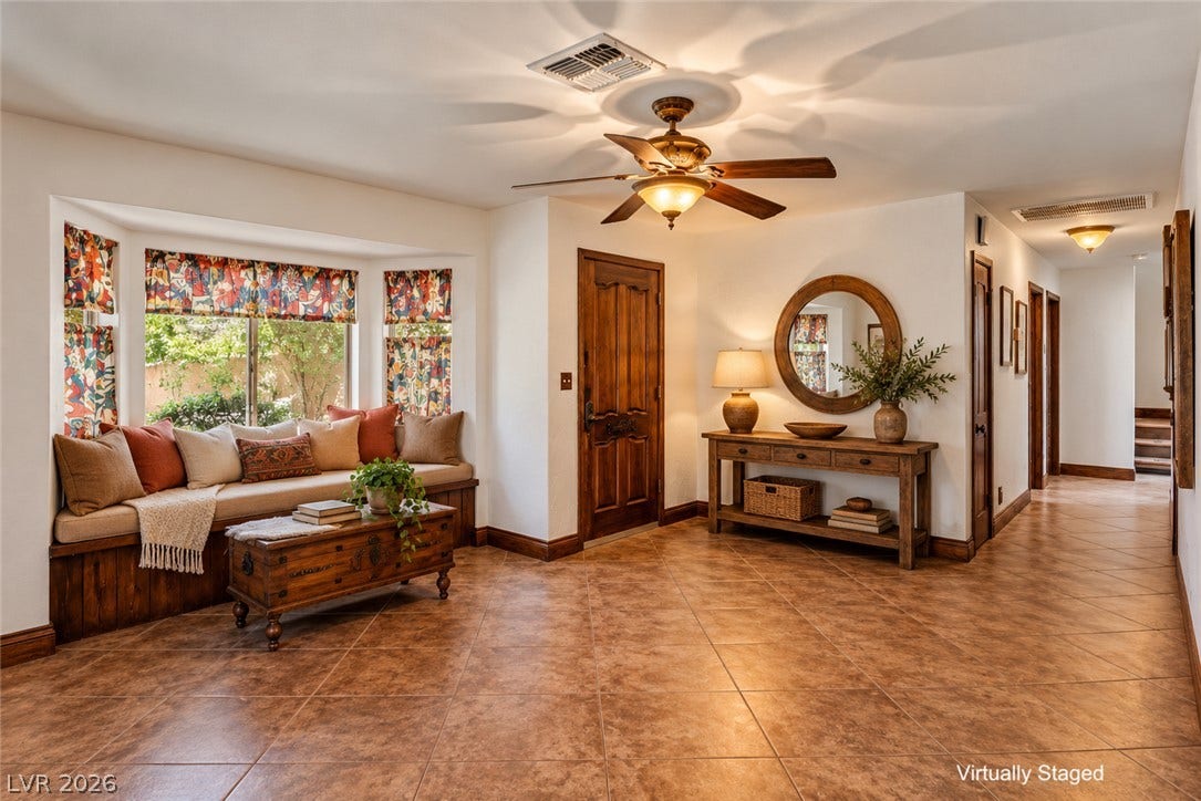 29 Cottonwood Drive, Blue Diamond, NV 89004 Earthy tile floors and a built-in window seat welcome guests into this warm entryway.