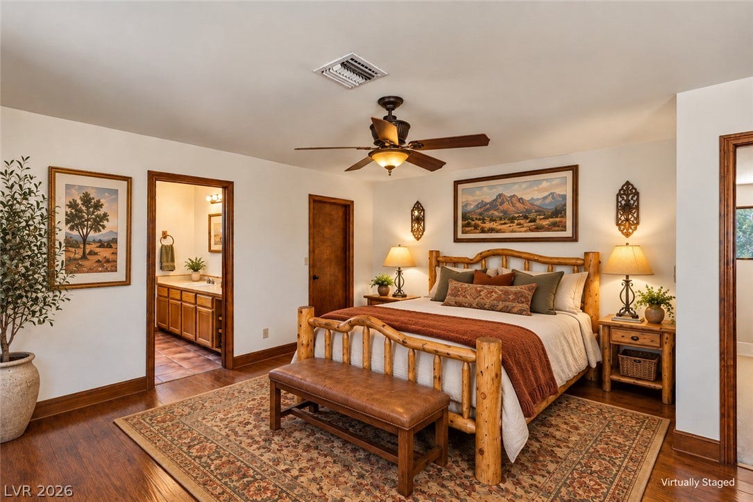 29 Cottonwood Drive, Blue Diamond, NV 89004 Rich hardwood flooring complements the warm wood trim in this inviting bedroom suite.