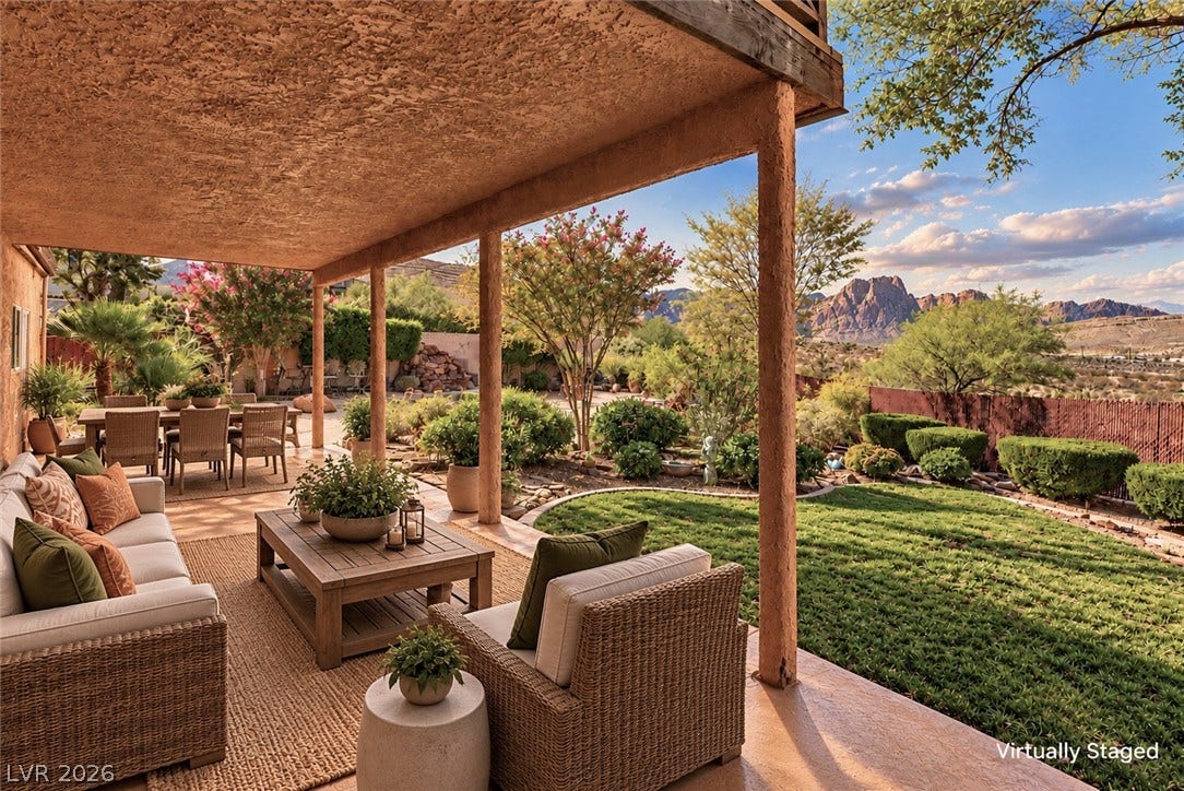 29 Cottonwood Drive, Blue Diamond, NV 89004 A spacious covered patio overlooks a beautifully landscaped yard with majestic Red Rock views.