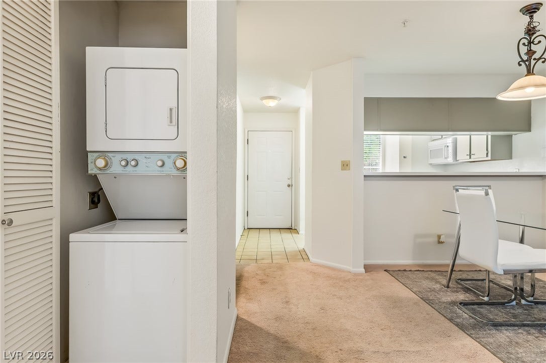 2036 Mesquite Lane, #303, Laughlin, NV 89029 Tiled entryway leads past a dedicated laundry alcove into an open dining area.