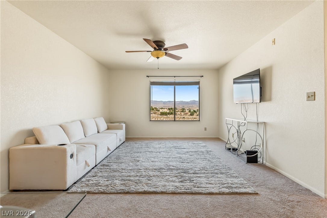 2036 Mesquite Lane, #303, Laughlin, NV 89029 Plush carpeting and a large window framing desert views define this comfortable space.