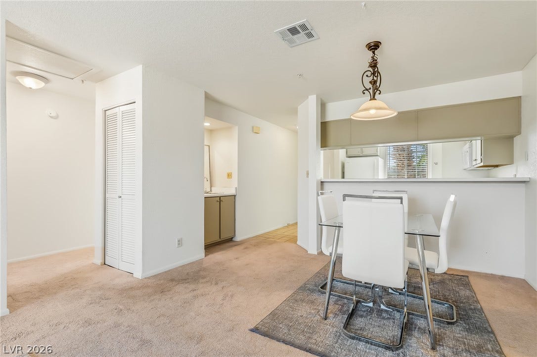 2036 Mesquite Lane, #303, Laughlin, NV 89029 An open floorplan seamlessly connects the dining space with the adjacent kitchen area.