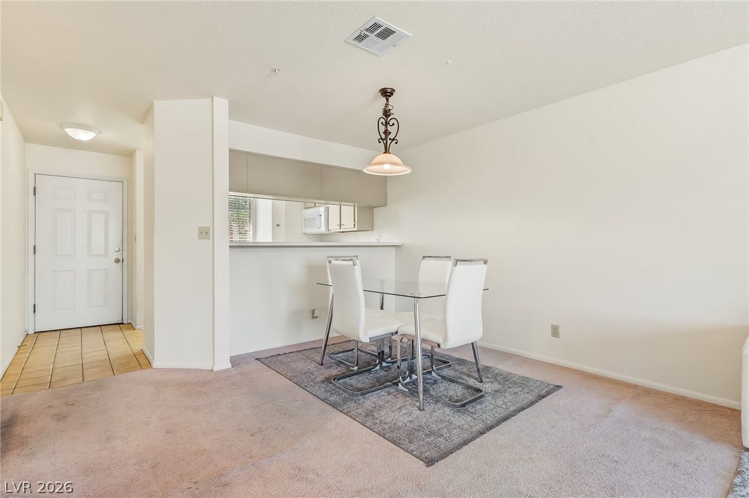 2036 Mesquite Lane, #303, Laughlin, NV 89029 A classic dining area connects smoothly to the kitchen and entry foyer.