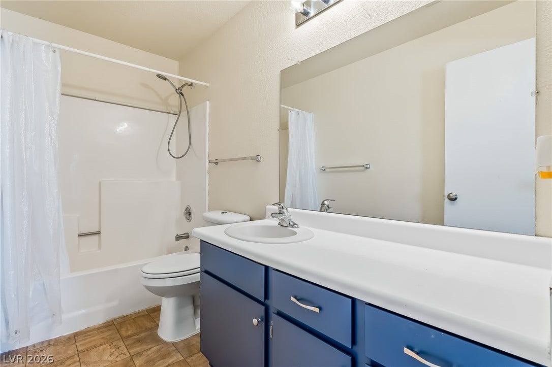 2036 Mesquite Lane, #303, Laughlin, NV 89029 Clean lines and a spacious vanity with integrated sink define this functional bathroom.