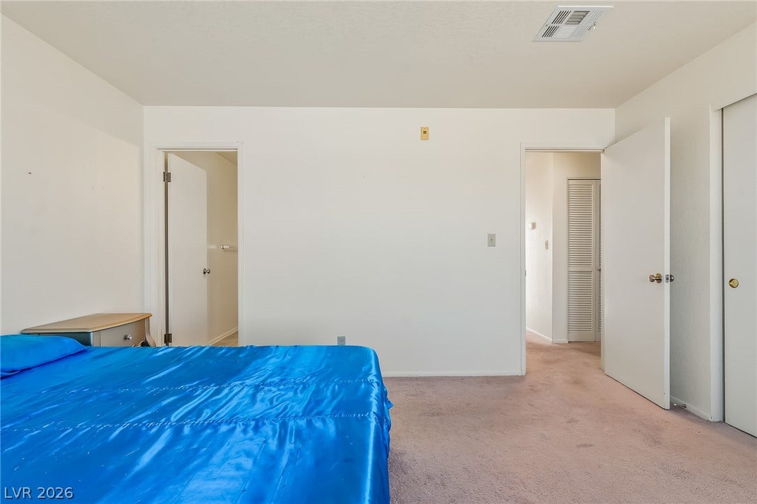 2036 Mesquite Lane, #303, Laughlin, NV 89029 Soft carpeting pairs with neutral walls in this versatile bedroom space.