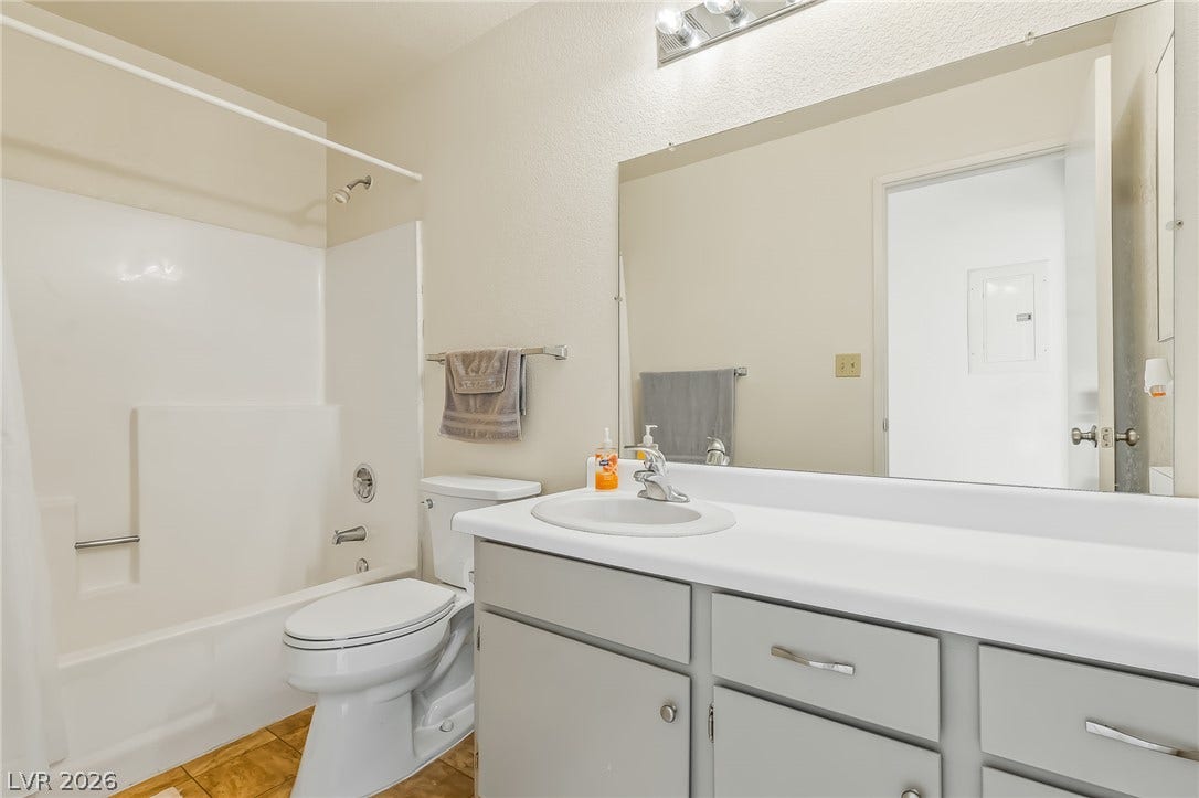 2036 Mesquite Lane, #303, Laughlin, NV 89029 Functional vanity storage and a combined tub and shower unit complete this classic bathroom space.