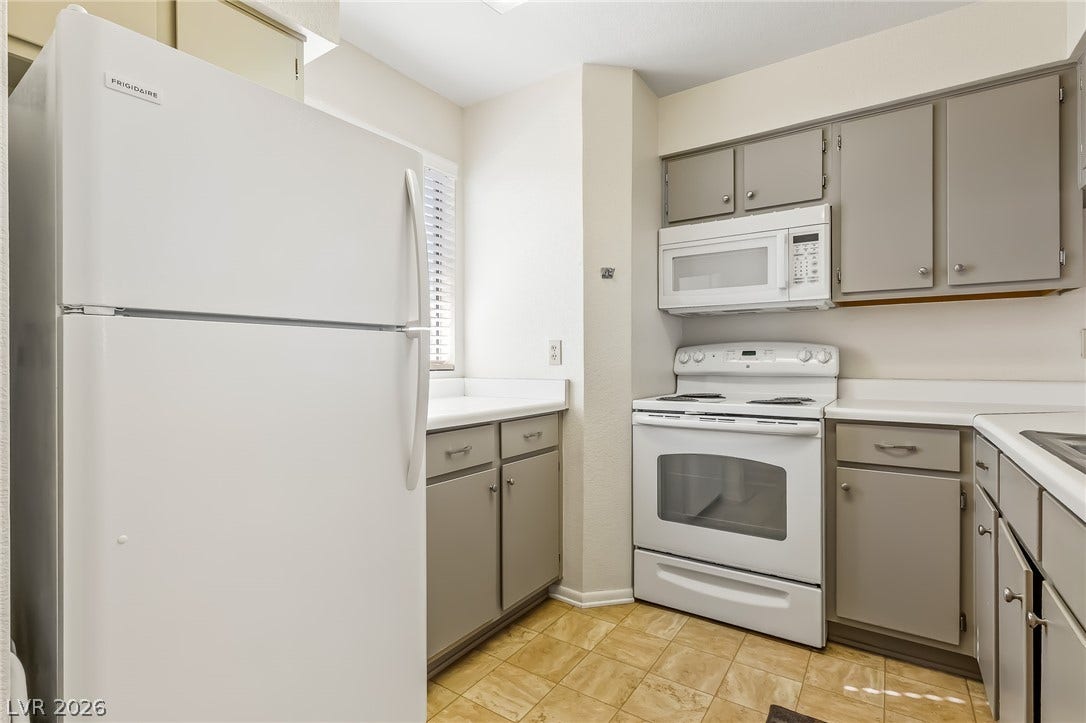 2036 Mesquite Lane, #303, Laughlin, NV 89029 Ample cabinetry and tile flooring define this functional workspace.
