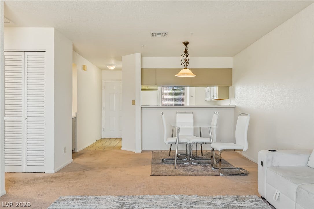 2036 Mesquite Lane, #303, Laughlin, NV 89029 An open floor plan connects the living and dining areas to the kitchen beyond.