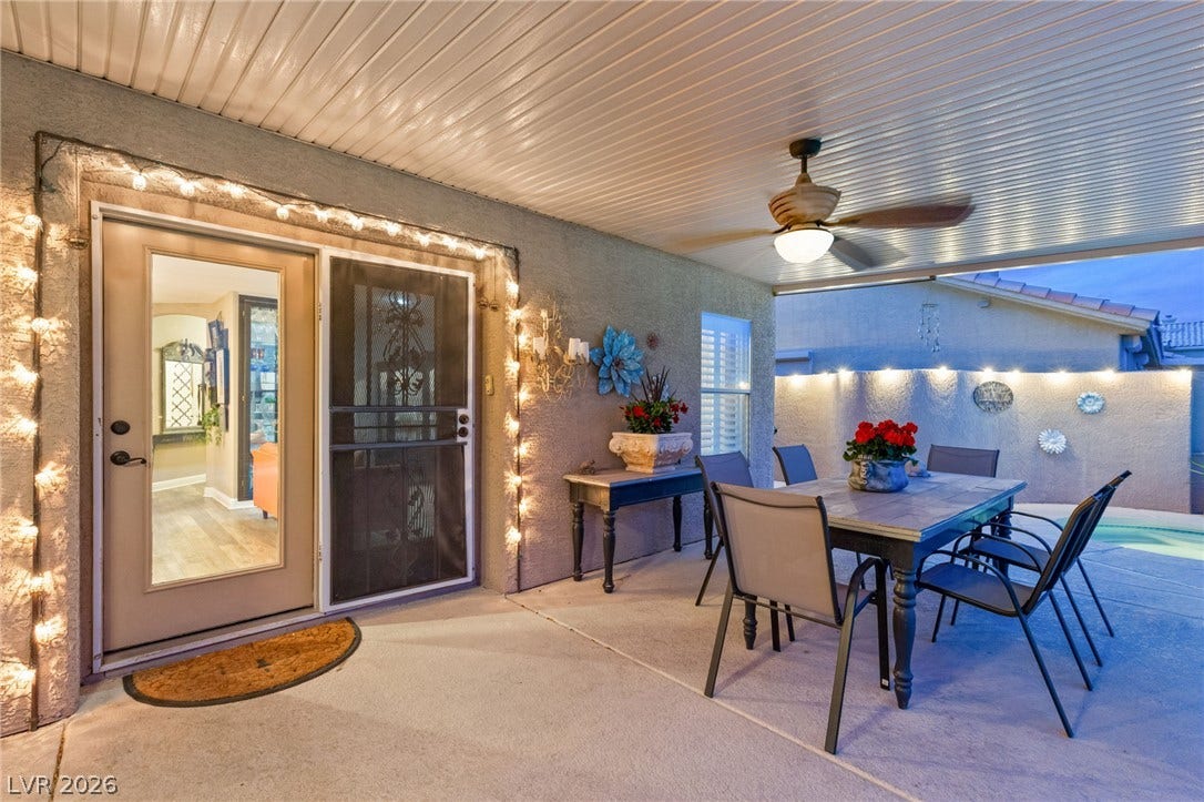3950 Candleglow Court, Las Vegas, NV 89147 Sheltered outdoor living transitions smoothly into the home through glass and screen doorways.