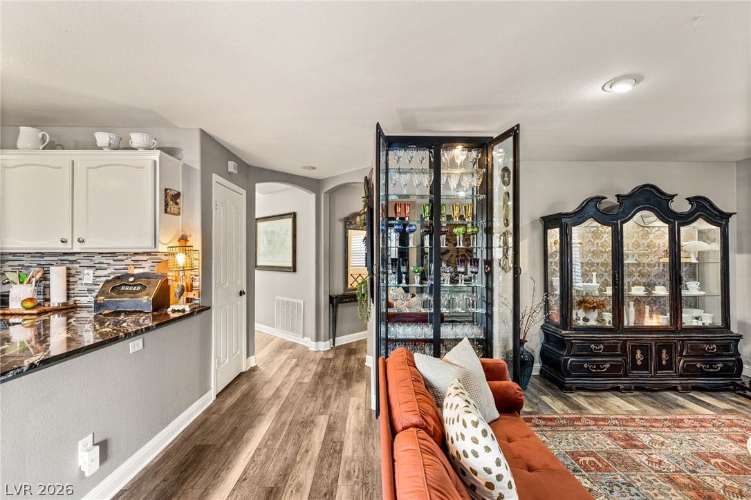 3950 Candleglow Court, Las Vegas, NV 89147 Polished stone counters and durable wood flooring enrich this versatile open floorplan living space.