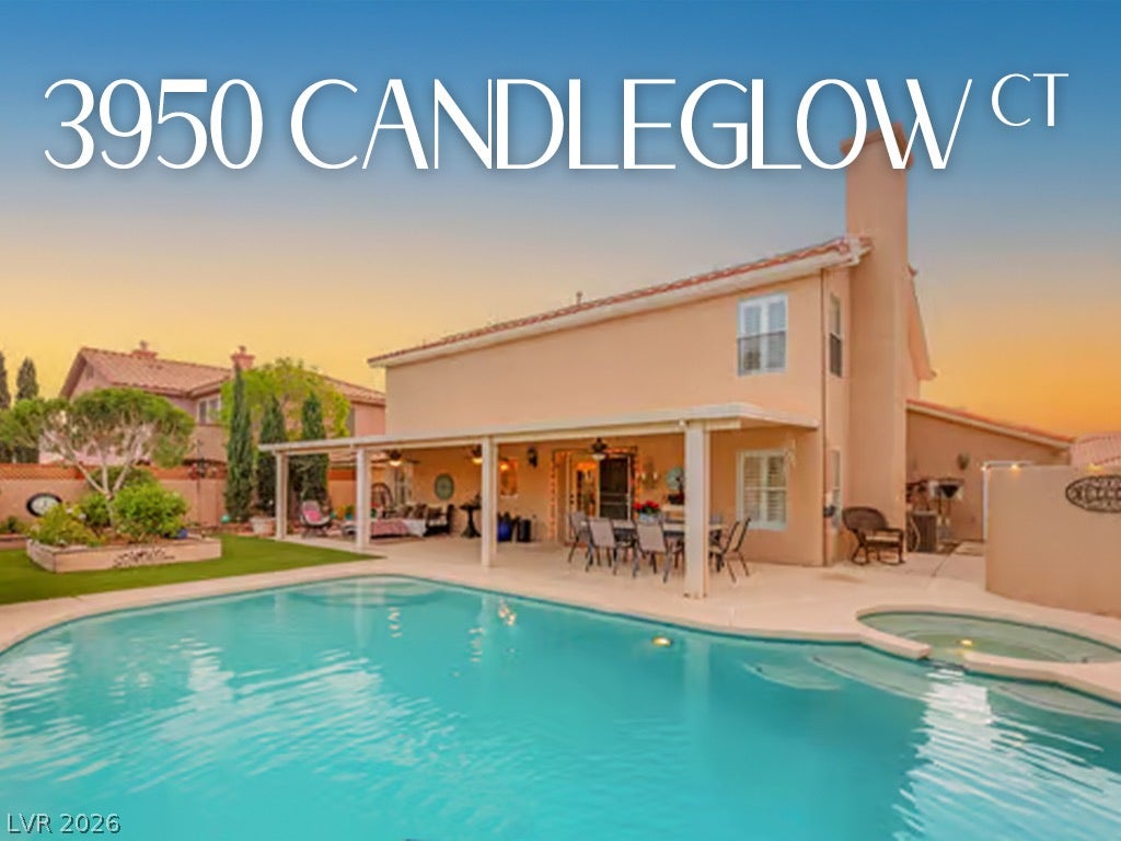 3950 Candleglow Court, Las Vegas, NV 89147 A sparkling swimming pool anchors the backyard retreat beneath a covered patio and tile roof.