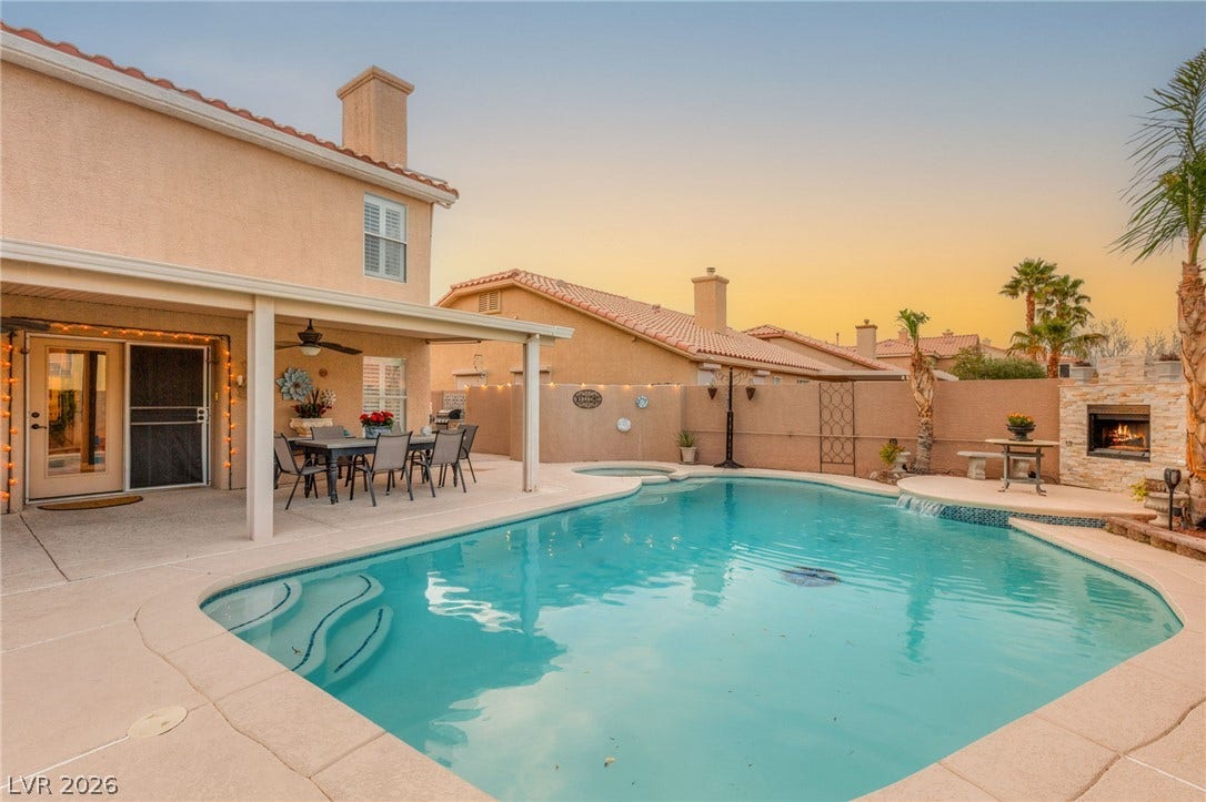 3950 Candleglow Court, Las Vegas, NV 89147 A sparkling swimming pool anchors the backyard of this classic stucco home.
