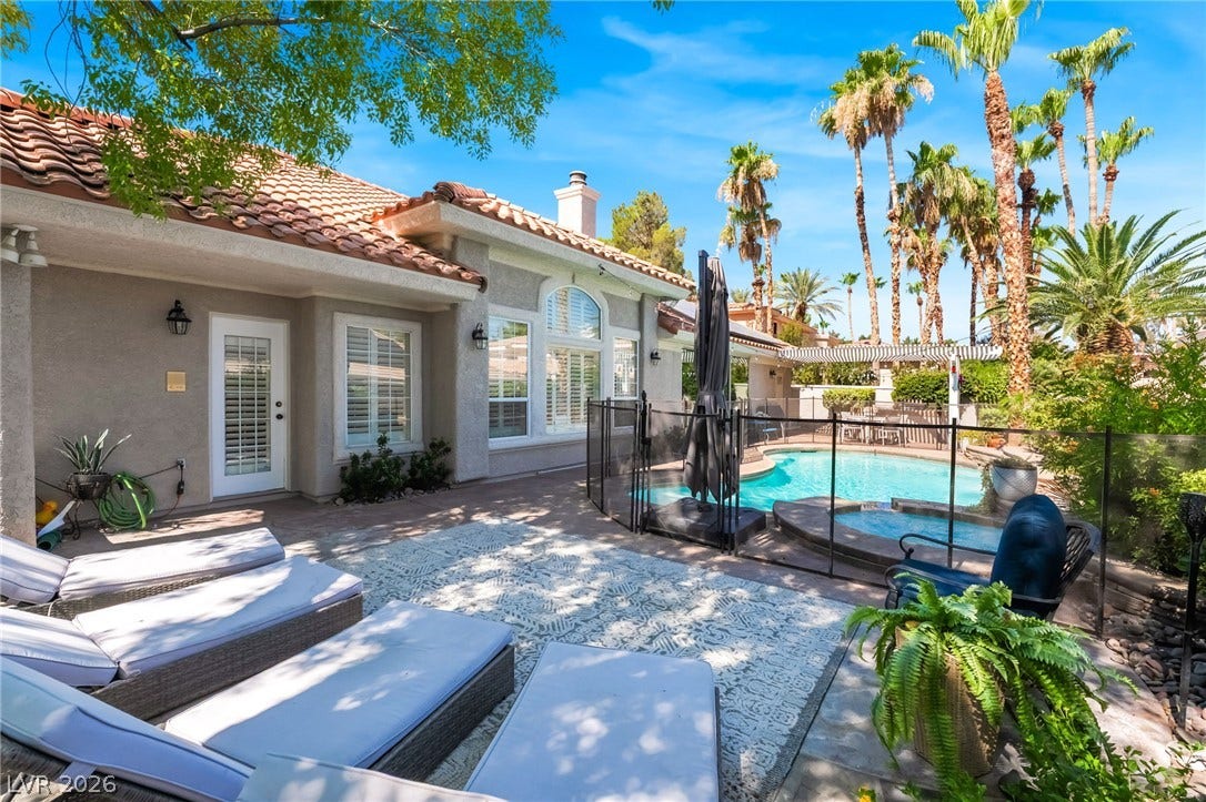 1892 Woodhaven Drive, Henderson, NV 89074 A private backyard oasis with an inviting pool and relaxing patio area, perfect for sunny afternoons.