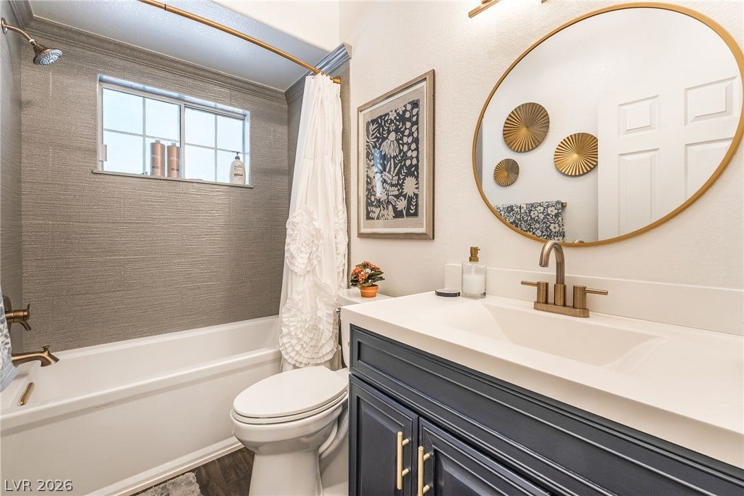1892 Woodhaven Drive, Henderson, NV 89074 A well-appointed bath features a sleek vanity, elegant fixtures, and practical storage.