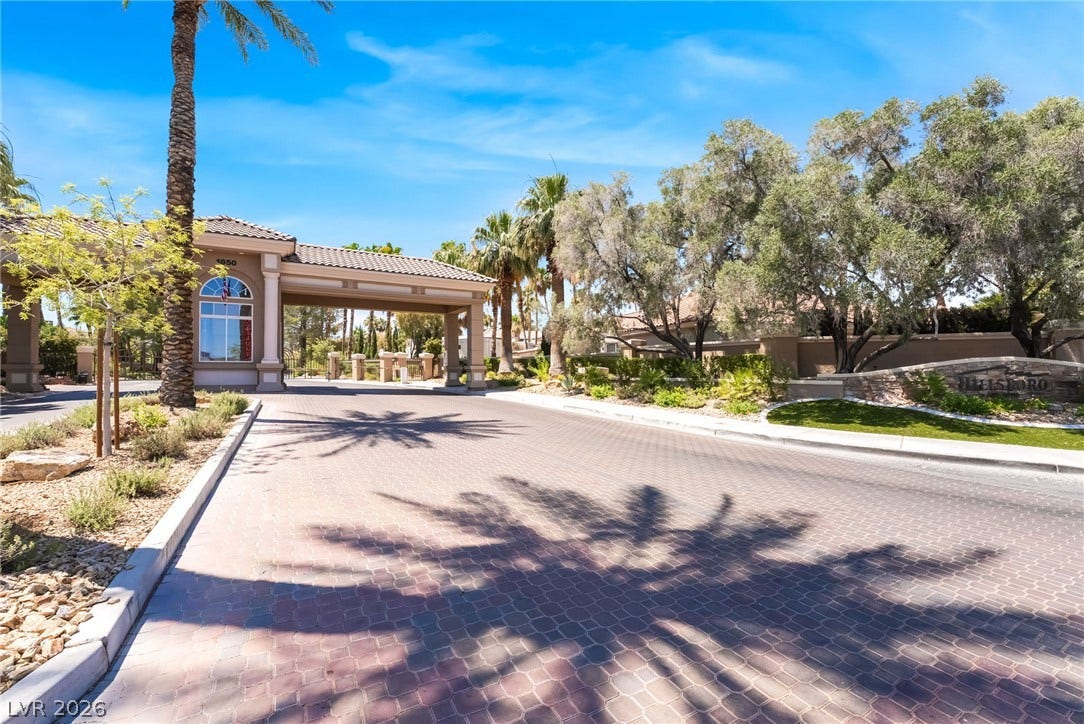 1892 Woodhaven Drive, Henderson, NV 89074 A grand entrance welcomes residents into this secure, tree-lined community.