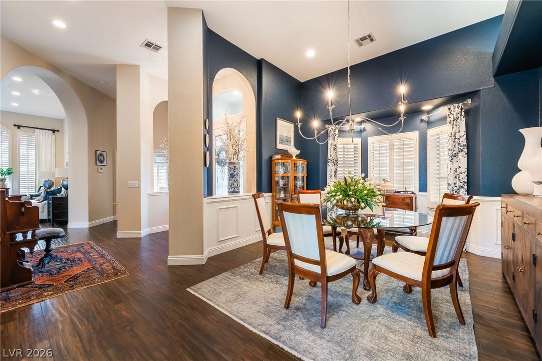 1892 Woodhaven Drive, Henderson, NV 89074 Elegant archways and rich hardwood floors define this inviting dining area.