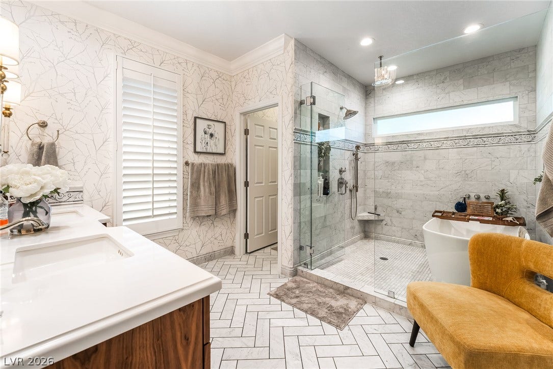 1892 Woodhaven Drive, Henderson, NV 89074 Indulge in a tranquil retreat featuring a spacious walk-in shower and elegant tile work.