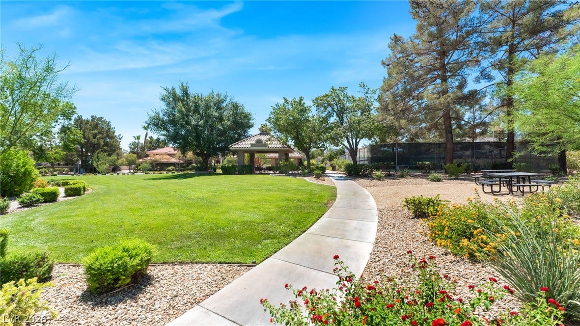 1892 Woodhaven Drive, Henderson, NV 89074 A winding path through verdant lawns leads to a charming gazebo, perfect for relaxation.