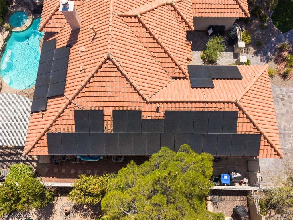 1892 Woodhaven Drive, Henderson, NV 89074 Solar panels adorn the tile roof of this property, featuring a private swimming pool and spa.