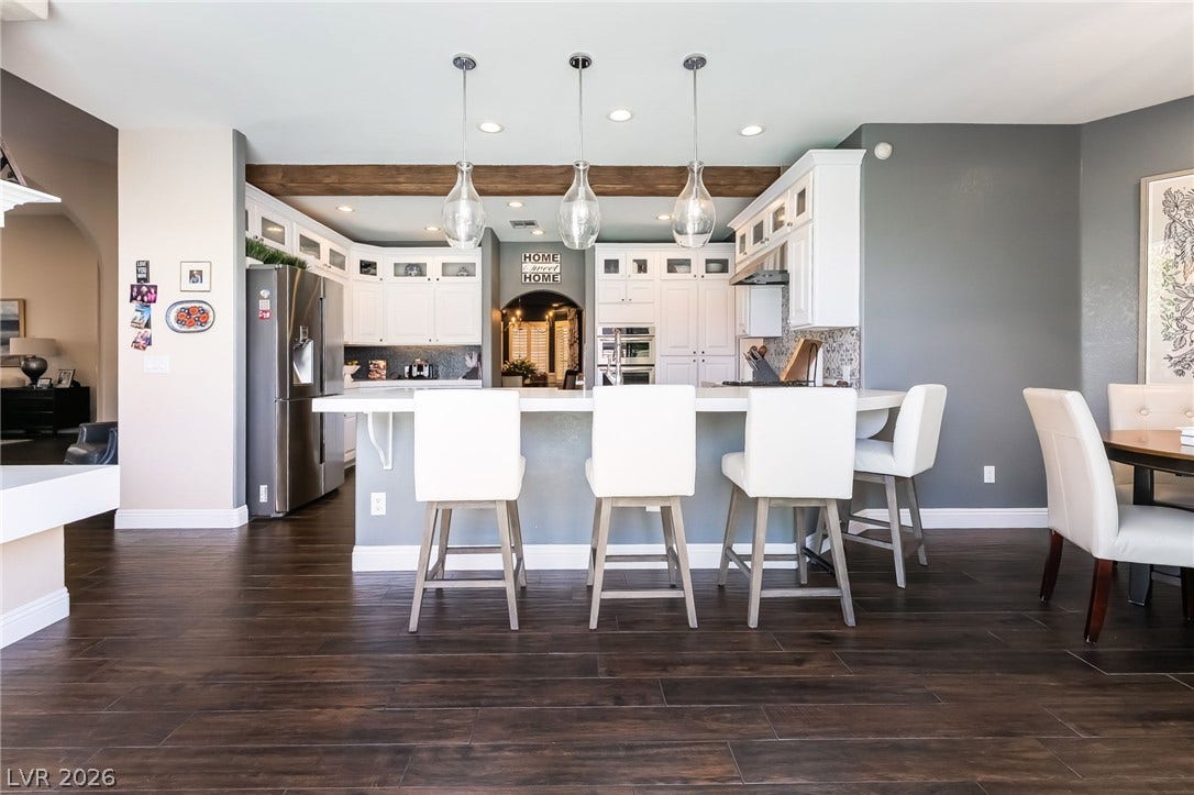 1892 Woodhaven Drive, Henderson, NV 89074 An inviting kitchen with a breakfast bar and modern appliances awaits culinary adventures.