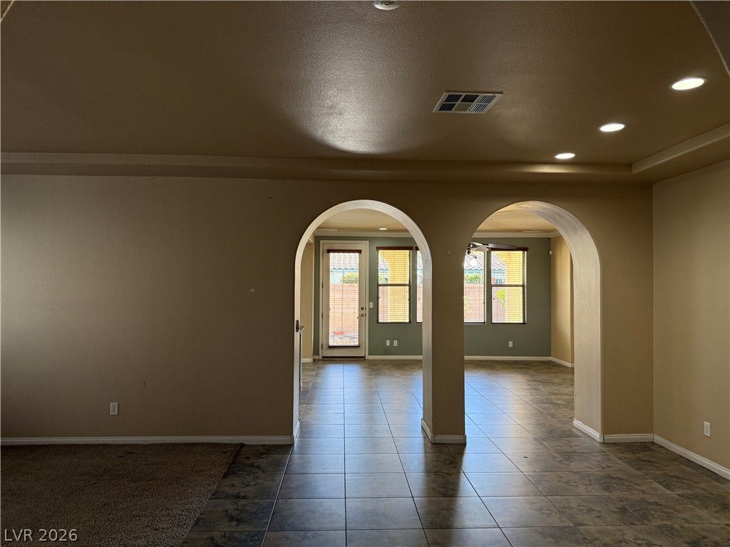 4327 Oasis Hill Avenue, North Las Vegas, NV 89085 Graceful arched doorways frame views into the adjoining sunlit living spaces.