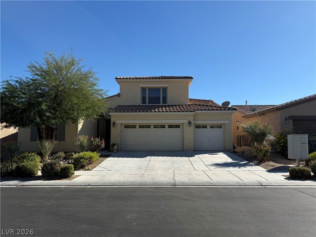 4327 Oasis Hill Avenue, North Las Vegas, NV 89085 Spanish tile roofing and structured stucco accents define this classic multi-car garage residence.