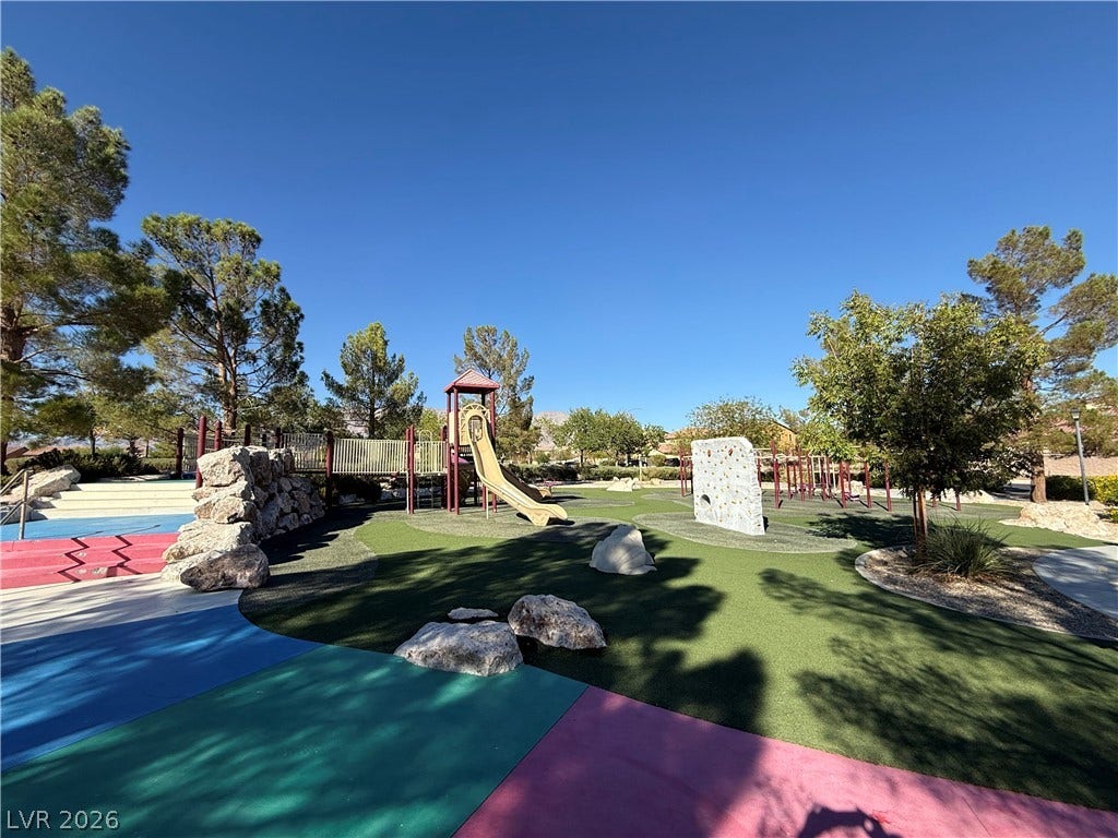 4327 Oasis Hill Avenue, North Las Vegas, NV 89085 A well-equipped community play area features structured climbing elements, slides, and safety surfacing.