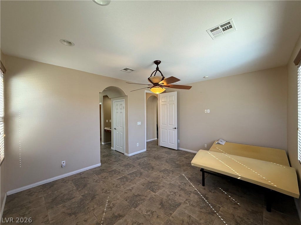 4327 Oasis Hill Avenue, North Las Vegas, NV 89085 Tiled flooring and arched doorways define this versatile space.